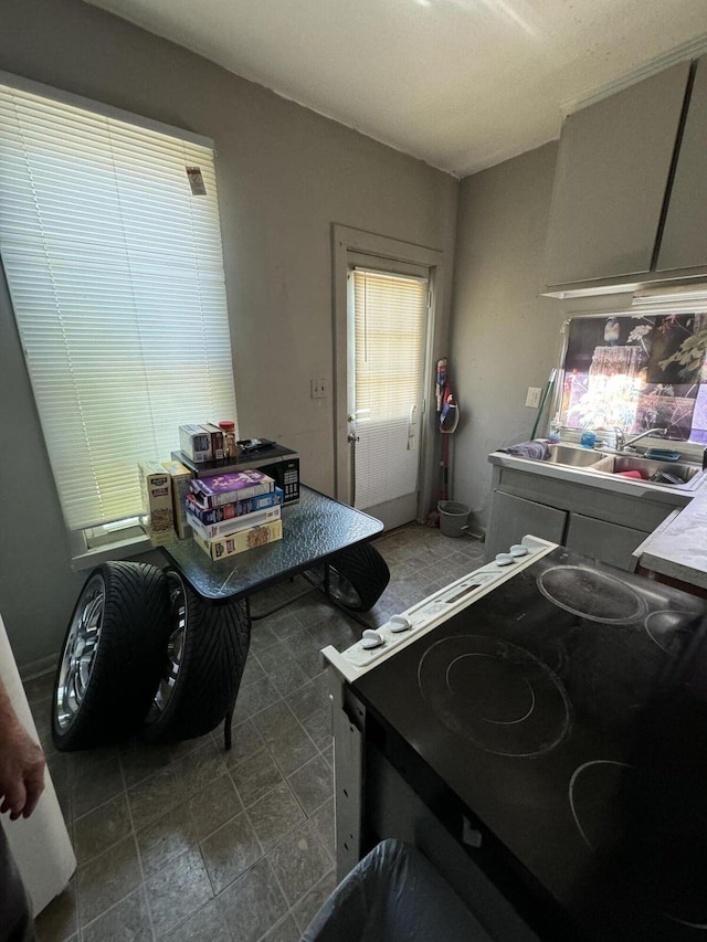 interior space featuring black electric range and a sink