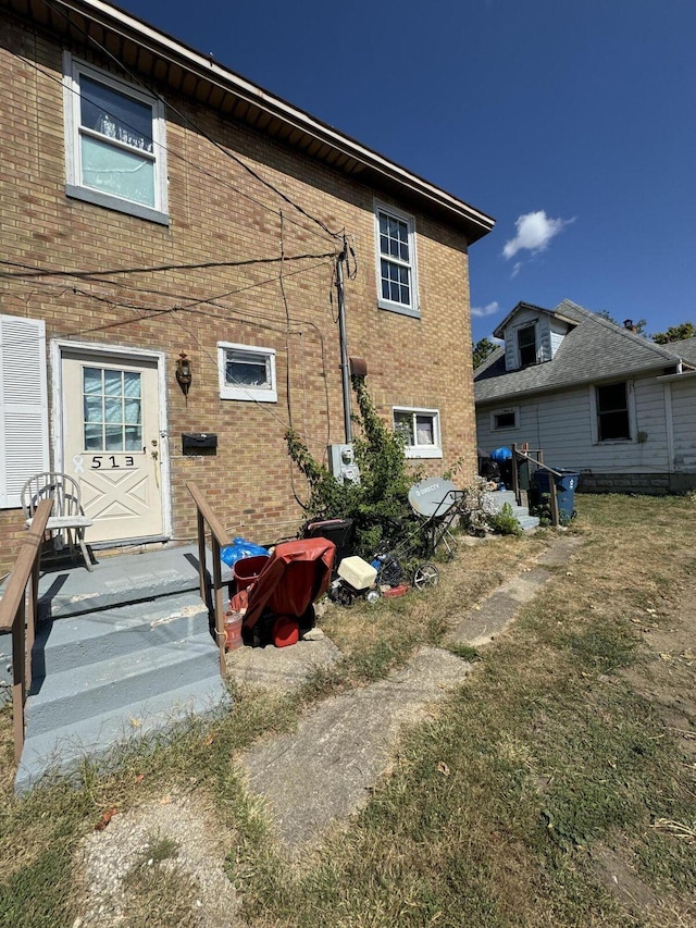 back of property with brick siding