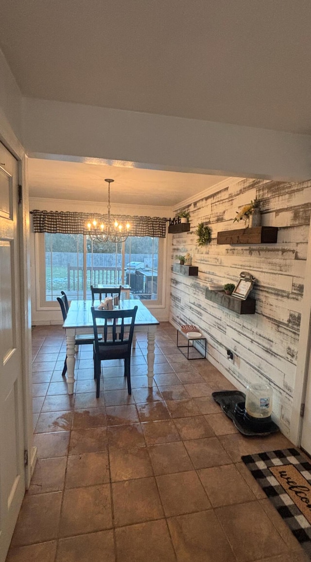 dining space with an inviting chandelier