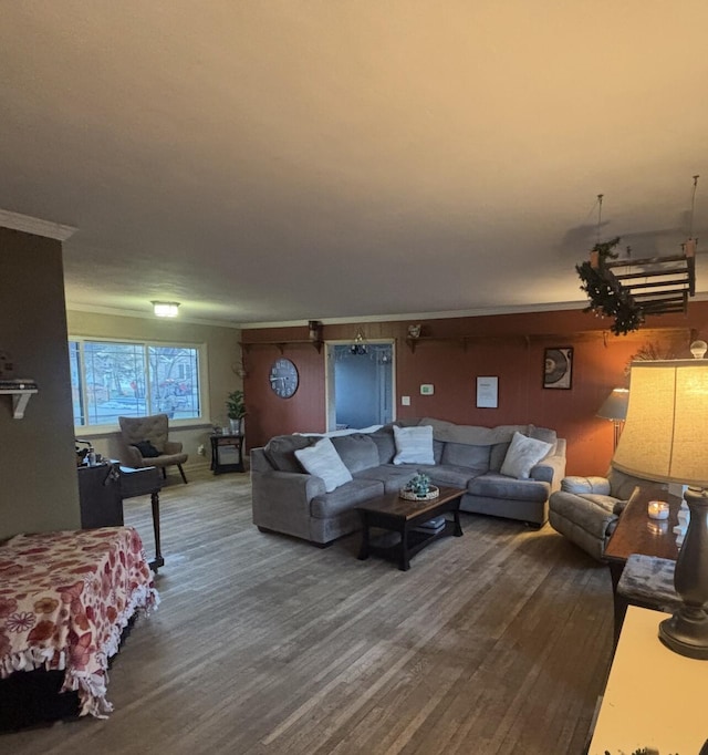 living room with hardwood / wood-style flooring and crown molding