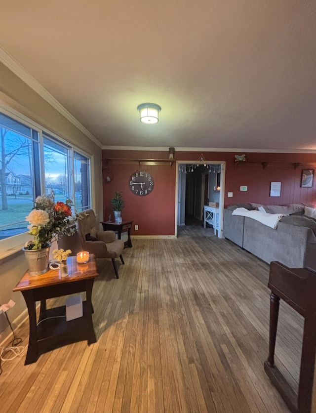 living room with ornamental molding and hardwood / wood-style floors