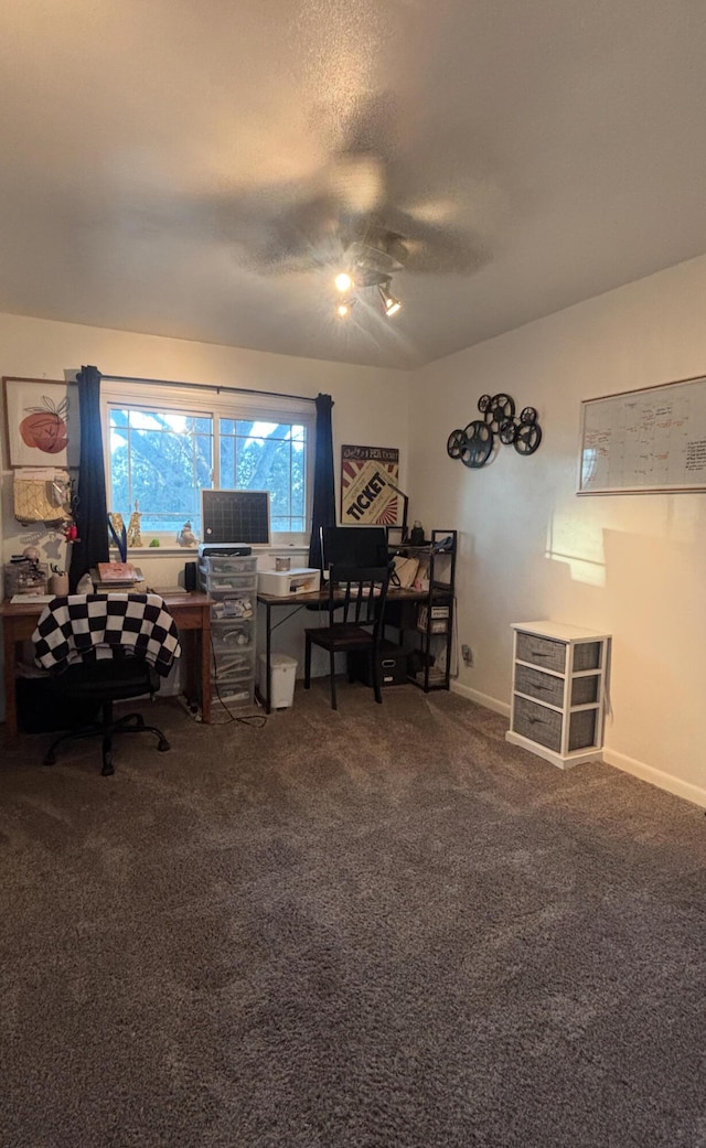 office area featuring dark carpet and a textured ceiling