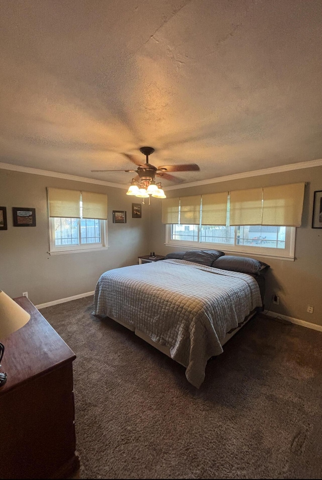 carpeted bedroom featuring ceiling fan, ornamental molding, and a textured ceiling