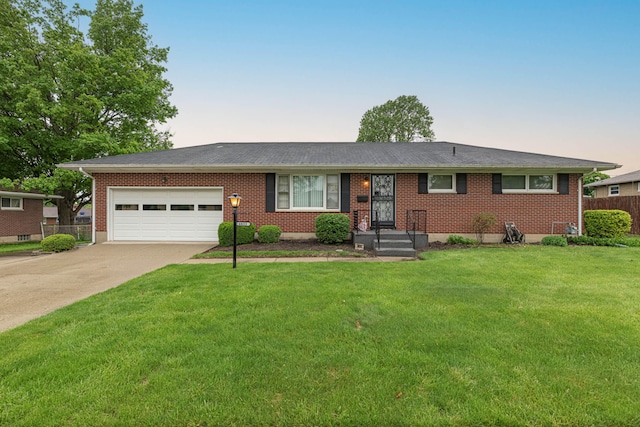 4833 Mesa Ln, Springfield, OH 45503 - single story home with an attached garage, concrete driveway, brick siding, and roof with shingles