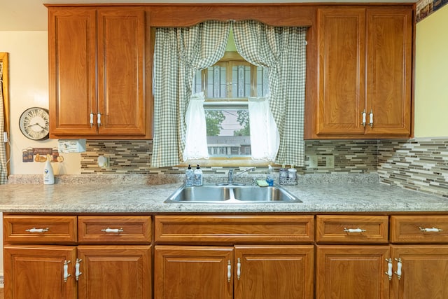 4833 Mesa Ln, Springfield, OH 45503 - kitchen with brown cabinetry and tasteful backsplash