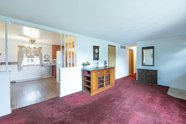 4833 Mesa Ln, Springfield, OH 45503 - carpeted living area featuring a baseboard radiator and a ceiling fan