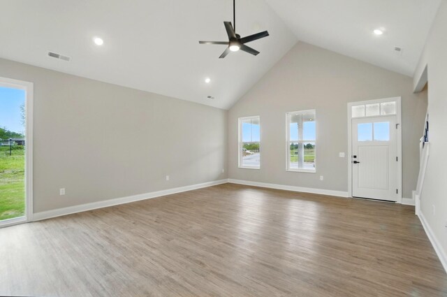 1505 Kingsgate Rd, Springfield, OH 45503 - unfurnished living room with ceiling fan, high vaulted ceiling, wood finished floors, plenty of natural light, and recessed lighting