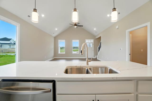 1505 Kingsgate Rd, Springfield, OH 45503 - kitchen featuring a sink, stainless steel dishwasher, open floor plan, white cabinets, and a ceiling fan