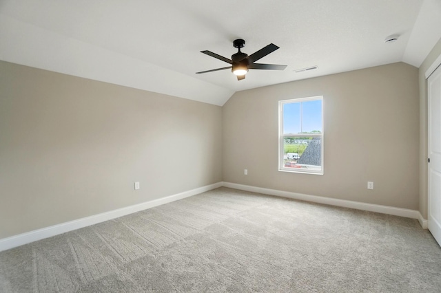 1505 Kingsgate Rd, Springfield, OH 45503 - spare room featuring vaulted ceiling, baseboards, ceiling fan, and light carpet