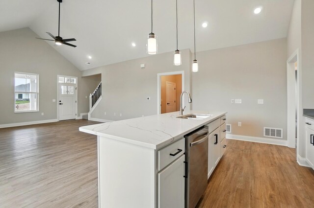1505 Kingsgate Rd, Springfield, OH 45503 - kitchen featuring a sink, ceiling fan, dishwasher, high vaulted ceiling, and baseboards