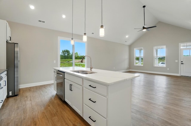 1505 Kingsgate Rd, Springfield, OH 45503 - kitchen with a sink, stainless steel appliances, light wood-style flooring, a ceiling fan, and baseboards