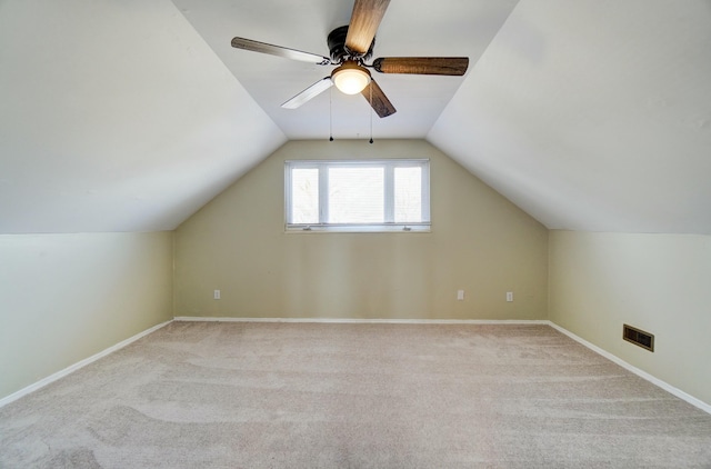 bonus room featuring lofted ceiling, carpet flooring, visible vents, and ceiling fan