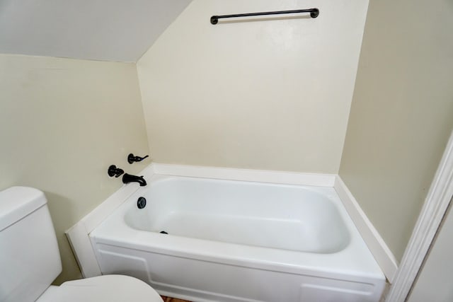 full bath featuring a tub and toilet