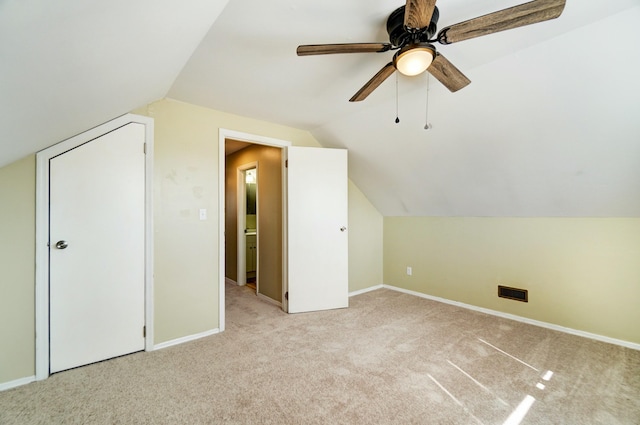 bonus room with lofted ceiling, carpet flooring, and baseboards