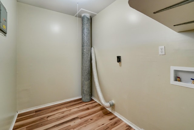 clothes washing area with light wood finished floors, baseboards, hookup for an electric dryer, hookup for a washing machine, and laundry area