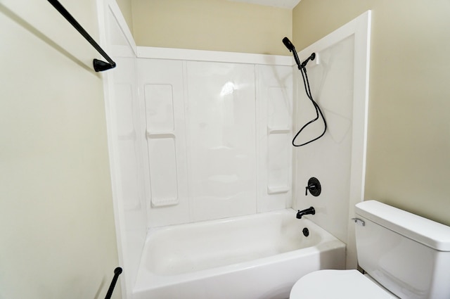 bathroom featuring toilet and  shower combination