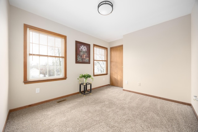 view of carpeted spare room