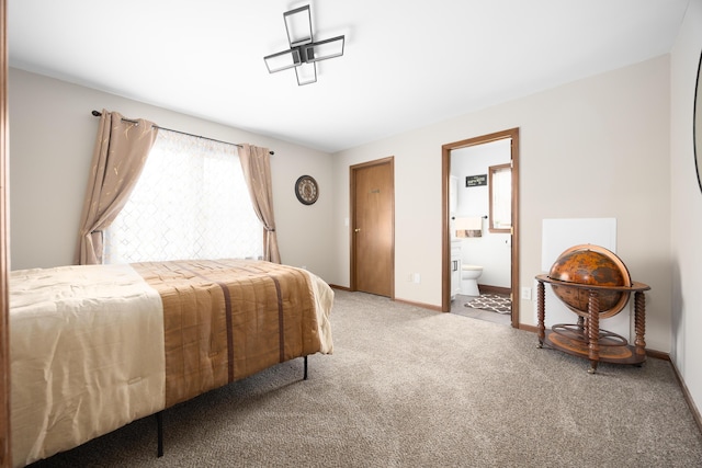 carpeted bedroom with ensuite bathroom