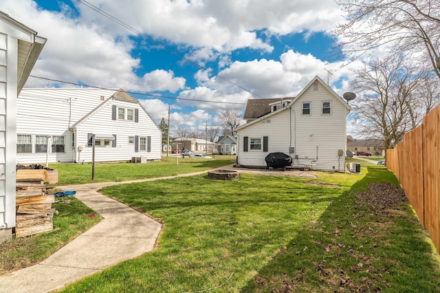 522 E High St, Saint Marys, OH 45885 - view of yard featuring a patio area, a fire pit, cooling unit, and fence