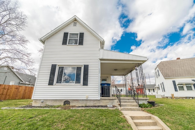 522 E High St, Saint Marys, OH 45885 - view of front of property with fence, a front lawn, and a porch