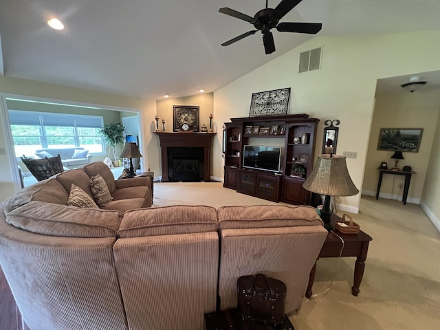 2732 Summer Field Trl, Sidney, OH 45365 - living area with carpet flooring, vaulted ceiling, a ceiling fan, and a fireplace