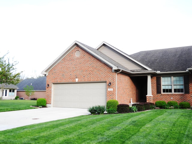 ranch-style home with a front lawn, roof with shingles, brick siding, an attached garage, and driveway