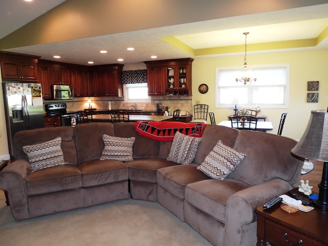 2732 Summer Field Trl, Sidney, OH 45365 - living area with a chandelier, recessed lighting, a tray ceiling, and light carpet