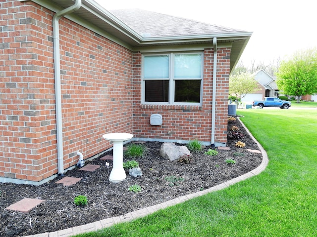 2732 Summer Field Trl, Sidney, OH 45365 - view of home's exterior featuring a lawn, brick siding, and a shingled roof