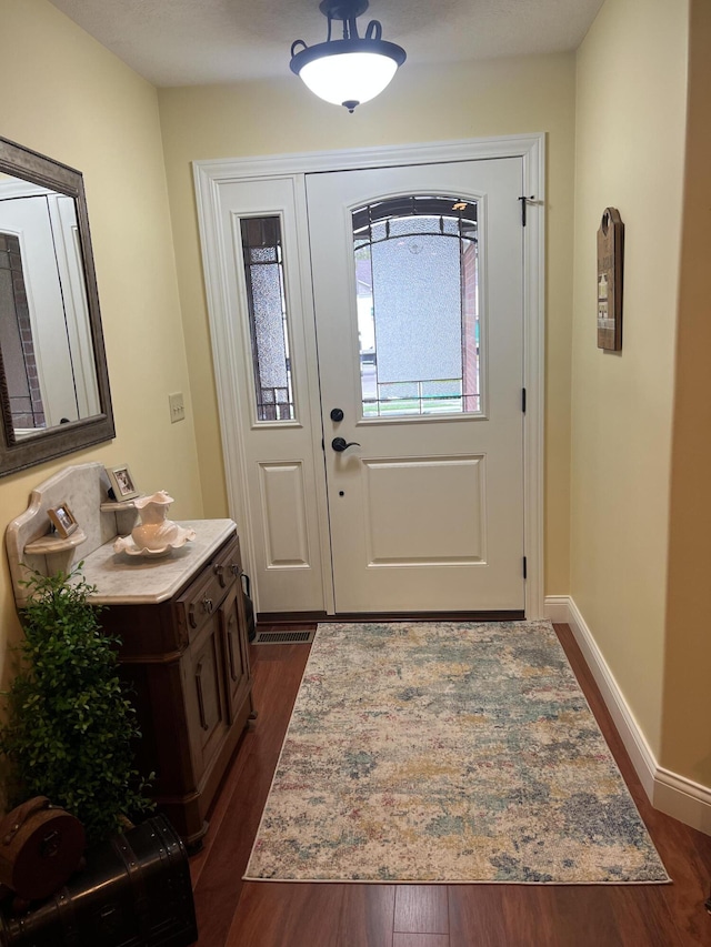 2732 Summer Field Trl, Sidney, OH 45365 - entryway featuring dark wood-style floors and baseboards