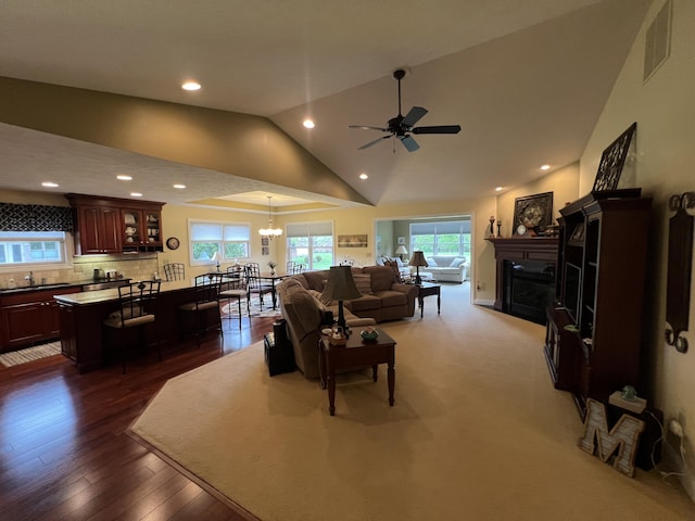 2732 Summer Field Trl, Sidney, OH 45365 - living room with vaulted ceiling, a fireplace, ceiling fan, recessed lighting, and dark wood-style flooring