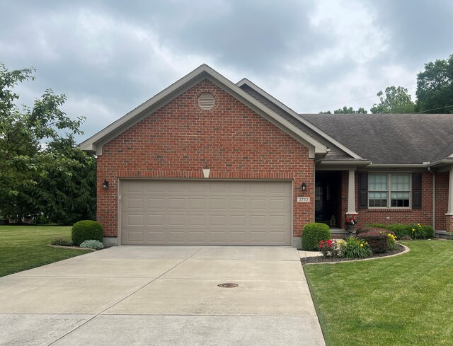 2732 Summer Field Trl, Sidney, OH 45365 - ranch-style home featuring concrete driveway, a front yard, brick siding, a garage, and roof with shingles