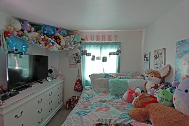 bedroom featuring light carpet