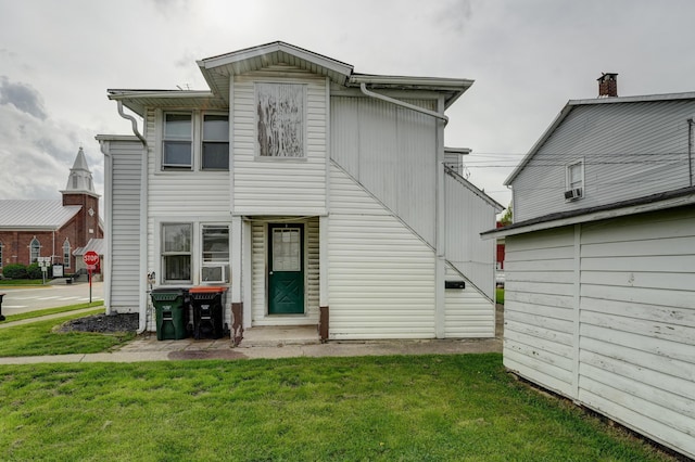 49 S W St, Versailles, OH 45380 - view of front facade with a front lawn and cooling unit
