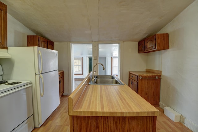 49 S W St, Versailles, OH 45380 - kitchen featuring white appliances, a sink, light wood-style flooring, a center island with sink, and butcher block counters