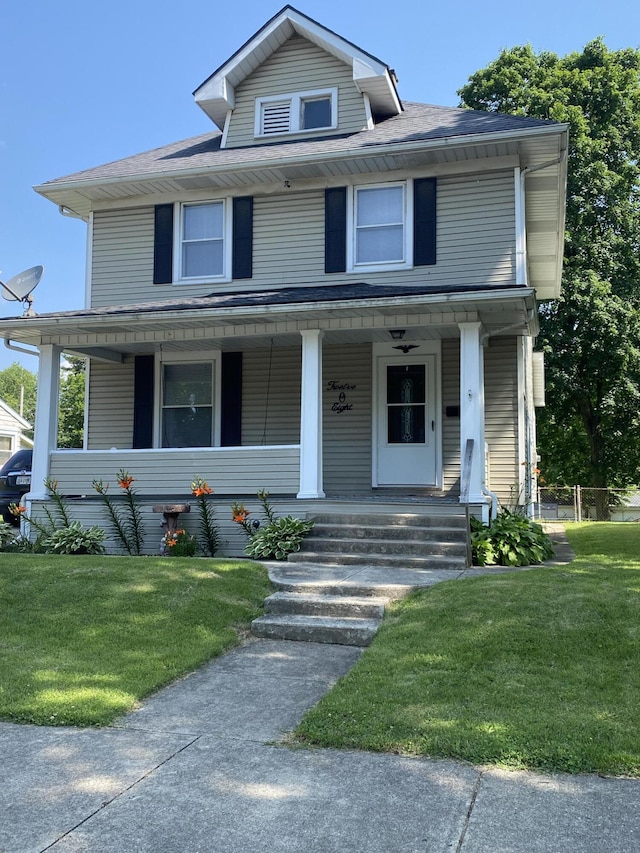 1208 Broadway St, Springfield, OH 45504 - traditional style home with a front yard, covered porch, and a shingled roof