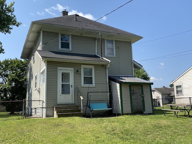 1208 Broadway St, Springfield, OH 45504 - rear view of property featuring entry steps, a chimney, and a gate