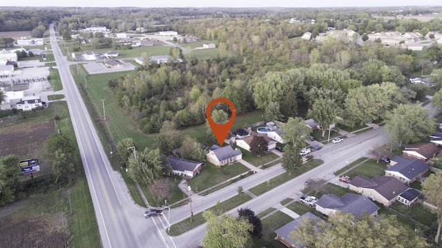 birds eye view of property with a residential view