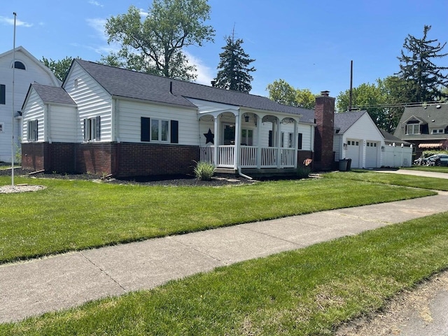 bungalow with roof with shingles, a front yard, a porch, and brick siding