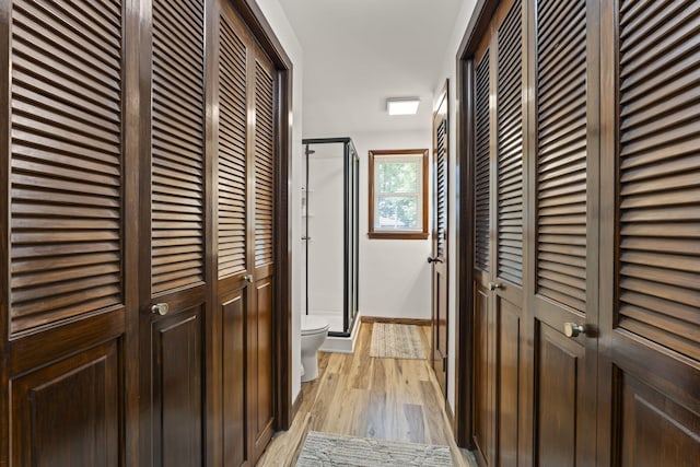 5899 N Springcreek Stringtown Rd, Piqua, OH 45356 - hallway with light wood-style floors and baseboards