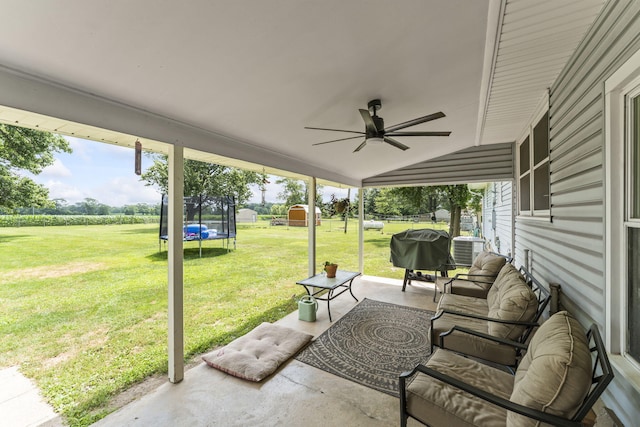 5899 N Springcreek Stringtown Rd, Piqua, OH 45356 - view of patio with a trampoline, a grill, and ceiling fan
