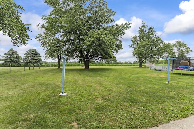 5899 N Springcreek Stringtown Rd, Piqua, OH 45356 - view of green lawn featuring a trampoline
