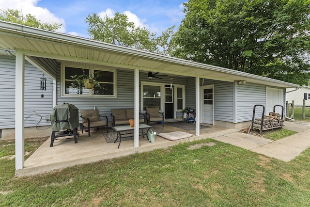 5899 N Springcreek Stringtown Rd, Piqua, OH 45356 - rear view of property featuring a ceiling fan, a lawn, and a patio