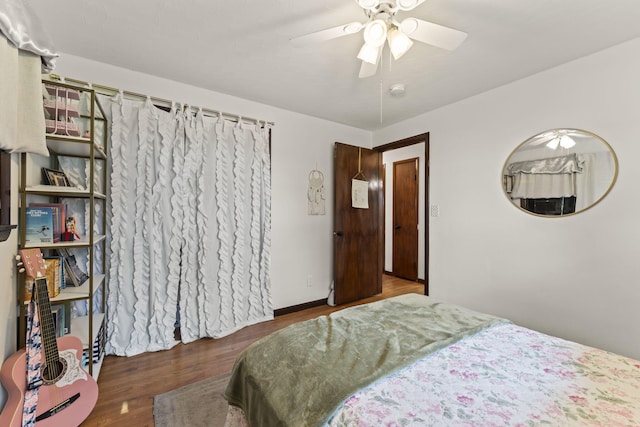 5899 N Springcreek Stringtown Rd, Piqua, OH 45356 - bedroom featuring wood finished floors and a ceiling fan