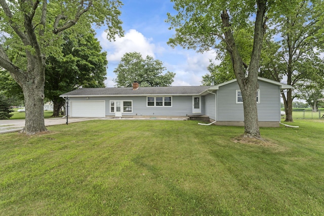 5899 N Springcreek Stringtown Rd, Piqua, OH 45356 - ranch-style home featuring concrete driveway, an attached garage, a front yard, and a chimney