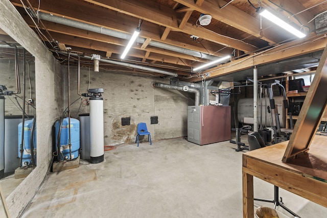 5899 N Springcreek Stringtown Rd, Piqua, OH 45356 - unfinished below grade area featuring a water pressure tank and a water softener