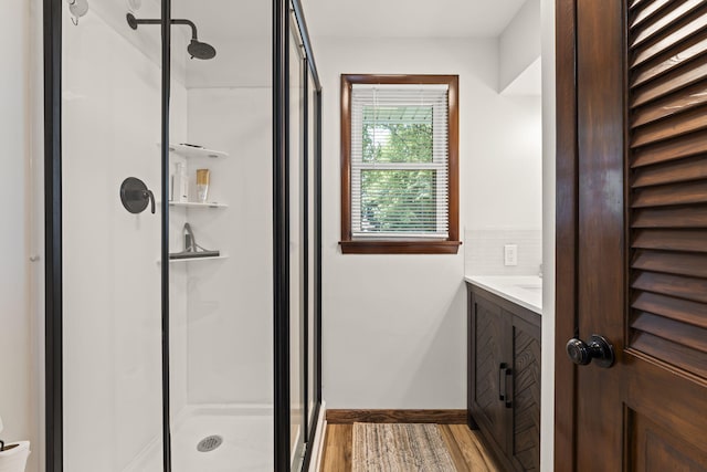 5899 N Springcreek Stringtown Rd, Piqua, OH 45356 - full bath featuring a stall shower, vanity, and wood finished floors