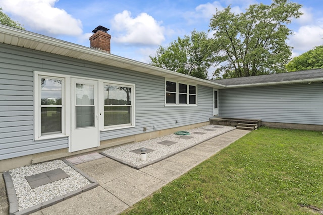 5899 N Springcreek Stringtown Rd, Piqua, OH 45356 - back of property with a yard and a chimney