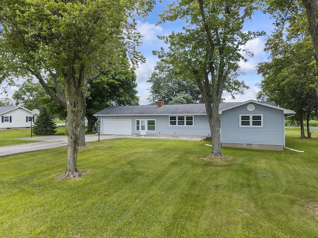 5899 N Springcreek Stringtown Rd, Piqua, OH 45356 - ranch-style house with driveway, a garage, a front lawn, crawl space, and a chimney