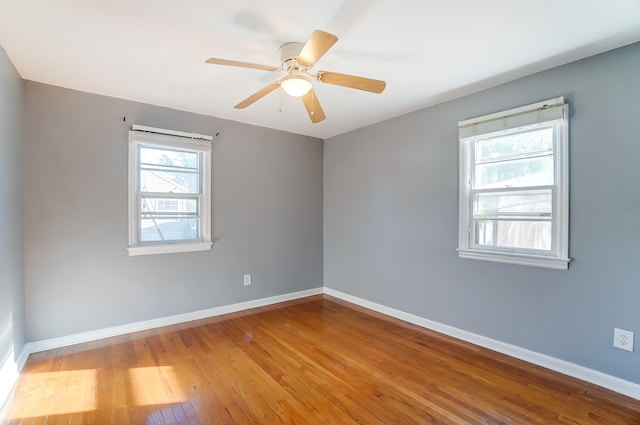 unfurnished room featuring ceiling fan and light wood-type flooring