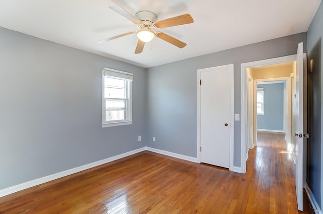 unfurnished bedroom featuring ceiling fan and wood-type flooring